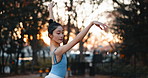 Sunset, dance and ballet woman in a park practicing for a concert, show or classical theater. Art, elegant and Japanese female ballerina in rehearsal with music at outdoor garden in nature in Autumn.