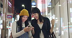Friends, walking home and smartphone for social media, laughing and happy with comments. Japan, public transport and streaming online with technology, funny and meme humour with communication