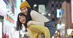 Japanese women, piggyback and happiness in city for travel, bonding and leisure on weekend vacation. Friends, care and goofy play in tokyo town for holiday, wellness and relax together for social