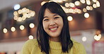 Japanese woman, face and happiness in city for travel, wellness and leisure on weekend vacation. Young person, smile and portrait in tokyo town on holiday, positive attitude and relax by bokeh lights