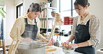 Cooking class, women and plating traditional food together as meal, japanese and kitchen with professional or skill. Noodles, ready and course for culinary, working together or aprons for cleanliness