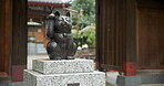 Cat, animal and statue of manekineko in Japan for luck, success and gratitude outdoor at Gotokuji temple. Sculpture, figure and traditional doll in Tokyo for happiness, lucky fortune and culture