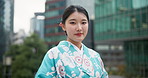 Face, traditional clothes and Japanese woman with a smile, city and peaceful with confidence, fashion and calm. Portrait, person and girl with stylish outfit, street and travel with urban town or joy