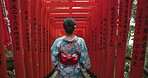 Woman, Japan and walking in kimono or shrine visit to Fushimi Inari, traditional in Kyoto. Female person, temple clothes and back view to worship building for spiritual journey, culture or heritage