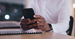 Business person, hands and phone at desk in office for social network, mobile chat and contact in company. Closeup, employee and typing on smartphone, scroll digital news app and search internet 