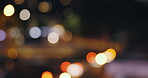 Lights, bokeh and night life on road in urban city for late evening, traffic or cars. Sparkle, dark and twilight for downtown street or holiday explore or outdoor travel for blur, lens flare or glow