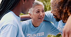 Teamwork, volunteer and group of people in huddle for discussion, charity meeting and planning. Volunteering, teamwork and men and women talking for donation, ngo business and community service