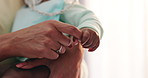 Love, baby and mother holding hands in a house with care, trust and security closeup while bonding. Children, safety and mama with kid at home with support, protection or calm, moment or nap routine