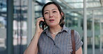 Woman, phone call and commute to work, city and smartphone, conversation and technology. Discussion, japan and speaking in urban area, office buildings and businesswoman for networking and chat
