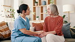 Happy woman, nurse and holding hands in elderly care, support or trust for healthcare advice or comfort at home. Female person, doctor or caregiver touching mature patient in nursing, help or therapy