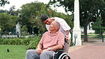 Elderly man, wheelchair and wife in park walking for bonding together or conversation, nature or explore. Person with a disability, woman and happy in garden for stress relief, weekend or retirement