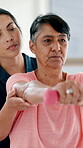 Senior woman, physical therapy and dumbbell exercise, stretching arm and support in physiotherapy exam. Workout, shoulder pain and fitness of elderly person, patient and nurse in medical consultation