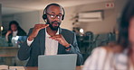 Man, night call center and laptop for customer support, e commerce FAQ or business communication in workspace. African advisor or consultant talking on computer for virtual solution, advice or sales