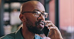 Face, phone call and business black man in office for communication, networking or negotiation. Contact, consulting or feedback with serious young employee in glasses talking on mobile at workplace