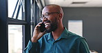 Happy black man, phone call and laughing in discussion for funny joke, meme or chatting by window at office. African male person or freelancer enjoying fun conversation or talk on mobile smartphone