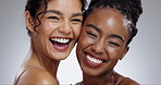 Women, face and skincare with laughing in studio with facial treatment, diversity or glowing skin. Friends, model and portrait with beauty for cosmetics, dermatology and support on gray background