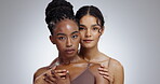 Beauty, friends and diversity with women in studio on gray background for natural aesthetic or wellness. Portrait, skincare and luxury with confident young people at spa for cosmetics or dermatology