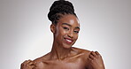 Woman, portrait and happy with body care in studio for glowing skin, wellness and detox with beauty. African model, person and mockup with hands for self love, smile or skincare with white background