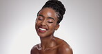Woman, face and happy with beauty in studio for glowing skin, wellness and detox with chemical peel. African model, person and mockup for facial treatment, body care or skincare with white background