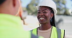 Face, smile and black woman construction worker talking to colleague on building site for planning. Industry, project management and architecture with happy young engineer speaking to coworker