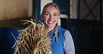 Smile, hay and woman in stable on ranch for hobby as trainer or professional jockey. Portrait, western or equestrian with happy young blonde person in barn or stall as rural cowgirl and rider