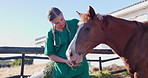 Doctor, woman and horse with care at farm with carrot, feeding and helping for nutrition with vegetable. Nurse, veterinarian and animal with eating, diet and wellness at countryside ranch in Texas
