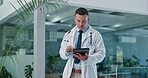 Doctor, walking with tablet and medical information, reading report or hospital management of online charts. Professional man on digital technology for healthcare, telehealth service and results