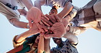 Friends, hand pile and teamwork outdoor for fun games together or competition, collaboration or blue sky. People, group and face below or hands clapping for sunshine adventure, winning or support