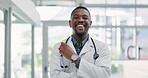 Man, doctor and confident for medicare in hospital, healthcare and satisfaction or pride for insurance. Black male person, stethoscope and care for cardiology in clinic, laugh and medic in portrait