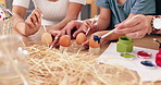Easter, painting and parents with children and eggs for holiday, festival celebration and decoration. Family, home and hands with paintbrush for creative activity, learning and bonding for tradition