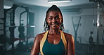 Fitness club, face and happy black woman confident in gym facility, muscle building or strength exercise. Commitment, portrait and African athlete smile for workout, training or challenge performance
