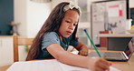 Girl, learning and writing with pencil, homework and book for development, knowledge and thinking at desk. Child, student and notebook by laptop for education, problem solving or notes in family home