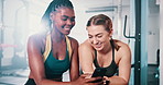 Gym friends, cellphone and people talk about online fitness routine, sports and woman consulting partner on exercise article. Phone, conversation and relax team post training to social network app