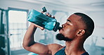 Gym, drinking water and black man with fitness, exercise and hydration with workout or training. African person, guy or athlete with wellness or health with liquid, strong or endurance with nutrition