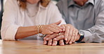 Closeup, senior couple and holding hands with empathy, love and support with compassion, bonding together and marriage. Home, old man and elderly woman with retirement, comfort and romance with trust