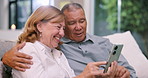 Hug, phone and senior couple on sofa for bonding, happiness and loving relationship in living room. Retirement, marriage and mature man and woman on smartphone for social media, website and internet