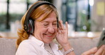 Elderly woman, headphones and cellphone for music listening for retirement, entertainment or streaming. Female person, smile and online radio for weekend audio for technology track, relax or playlist