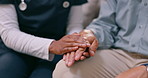 Holding hands, senior person and nurse with care, comfort or support in grief, mental health or anxiety in home. Caregiver, doctor and elderly patient with empathy, kindness and closeup in retirement