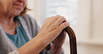 Hands, senior woman and walking stick in closeup for recovery, balance and rehabilitation in nursing home. Retirement, wood cane and elderly person with disability for steps, movement or mobility aid