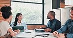 Documents, meeting and tablet with business people in boardroom of office for discussion. Administration, technology and teamwork with colleagues or coworkers in workplace for planning or negotiation