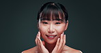 Korean, skincare and face of woman with beauty in studio with confidence and pride from dermatology. Happy, girl and smile for healthy glow on natural skin from facial or cosmetics in dark background