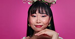 Woman, face and Asian beauty or cosmetics in studio with flower crown for pink background, confidence or skincare. Female person, plant wreath and natural with makeup or Korea, mockup or haircare