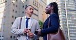 Business woman, man and talking in street, discussion and greeting on commute with smile in city. People, friends or staff in conversation, kindness and happy for chat on metro sidewalk travel to job