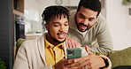 Happy, phone and young gay couple networking on social media, mobile app or the internet on sofa at home. Smile, technology and lgbtq men scroll on website with cellphone in living room at apartment.