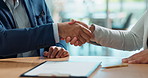 Business people, sign contract and handshake for agreement, legal deal and partnership negotiation in office. Shaking hands, signature on documents and closeup of lawyers in collaboration in meeting