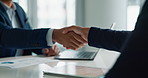 Business people, closeup and handshake for deal, agreement and partnership negotiation in office. Shaking hands, contract and hiring offer for recruitment, interview and financial analyst in meeting