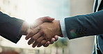 Business people, shaking hands and closeup for deal, b2b partnership and welcome with deal in city. Person, agreement or greeting with respect, hello and meeting with handshake on metro sidewalk