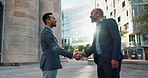 Business men, friends and shaking hands in city for introduction, hello or meeting with respect, smile or welcome. People, professional staff and happy for handshake, deal or agreement for onboarding