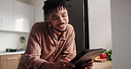 Happy black man, tablet and research in kitchen for social media, networking or communication at home. Young African male person smile on technology for cooking, tutorial or online search at house