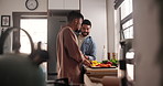 Man, gay couple and cooking vegetables for food, preparing or cutting meal together in kitchen at home. Young male person, lovers or LGBTQ relationship making healthy snack for nutrition at house